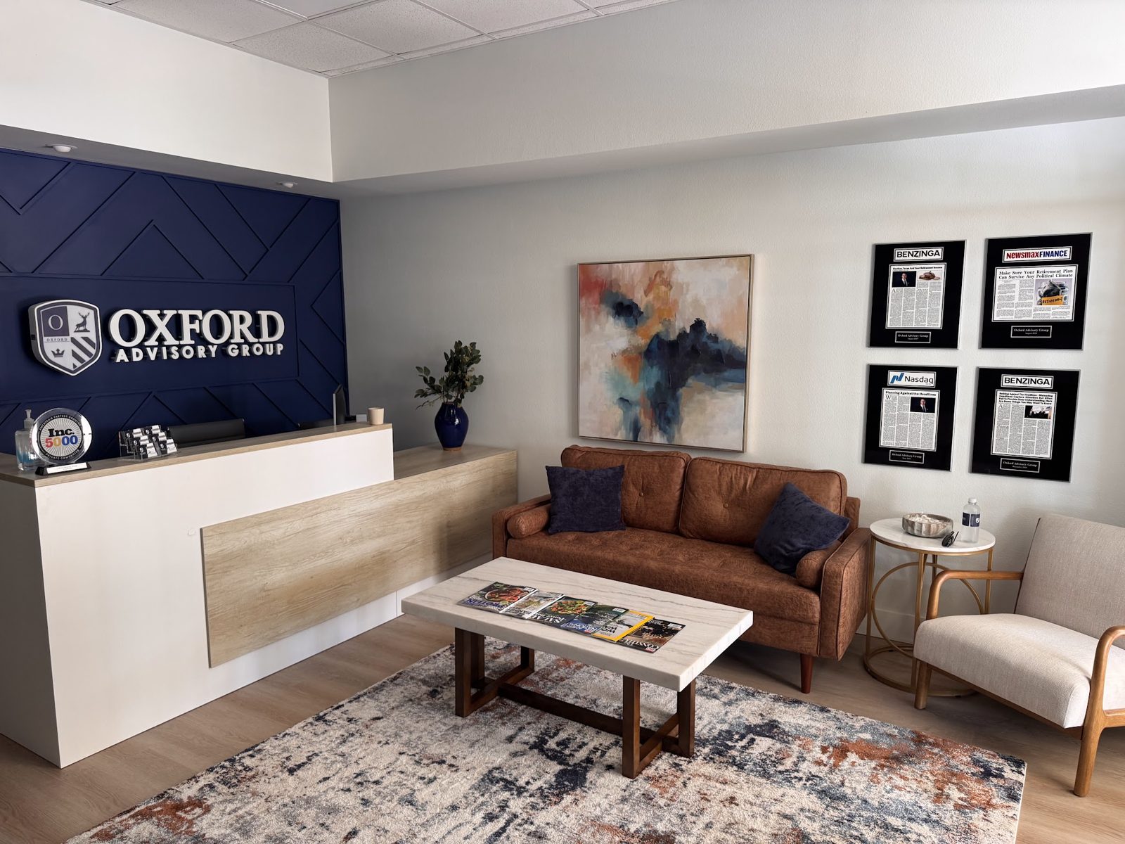 Reception area and logo wall at the Oxford Advisory Group Venice, FL office